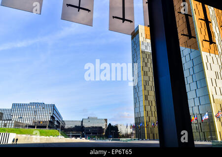 Couple walking near the European Commission and the twin towers of the Court of Justice of the European Union in Luxembourg City Stock Photo