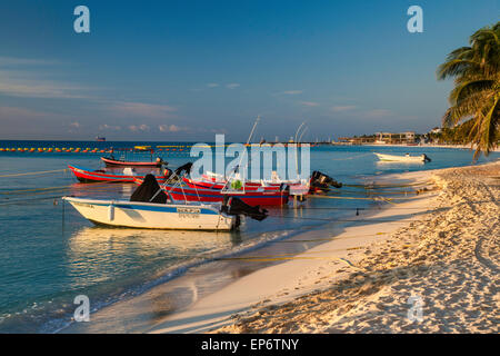 Fishing boats at Caribbean Sea beach, sunrise in Playa del Carmen, Riviera Maya, Yucatan Peninsula, Quintana Roo state, Mexico Stock Photo