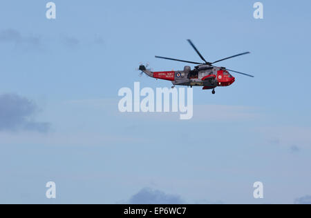 Royal Navy rescue helicopter with doors open in the skies above St Ives Cornwall England Europe Stock Photo