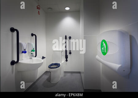 Disabled toilet with hand basin and fold down baby changing station Stock Photo