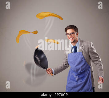 Boy making pancakes Stock Photo