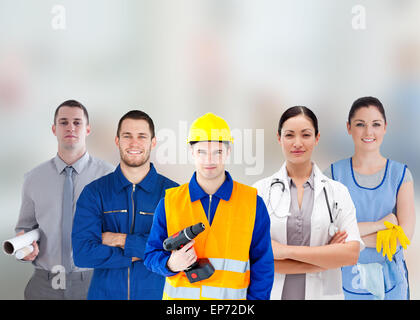 Smiling people with different jobs standing arms folded in line Stock Photo