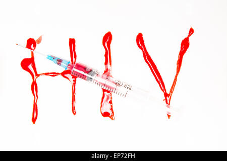 HIV spelled out in blood and syringe filled with blood Stock Photo