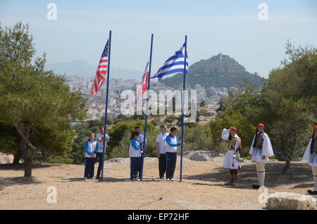 Athens, Greece. 14th May, 2015. Volunteers raise the flags of USA, Greece and special Olympics.Special Olympic Hellas organised a Ceremony in the Sacred Site of Pnyx in Athens for the Lighting of the Flame of Hope For Special Olympics World Games Los Angeles 2015. Credit:  George Panagakis/Pacific Press/Alamy Live News Stock Photo