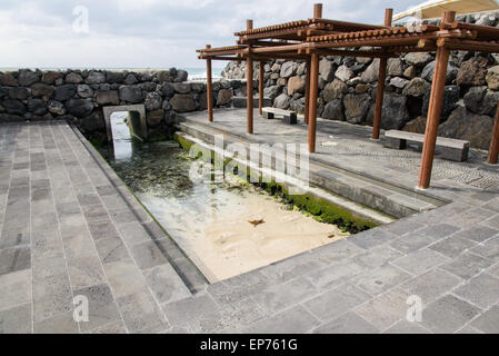 Gwamul open-air public bath. It is a traditional bath of Jeju Island and located near the Gwakji beach in Aewol. Stock Photo