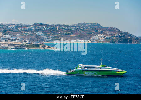 Hellenic Seaways flying cat fast ferry leaving Mykonos with the iconic windmills in the background Stock Photo