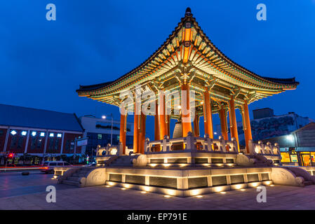 The bell pavilion of Hwaseong Fortress lit up as evening comes on. Stock Photo