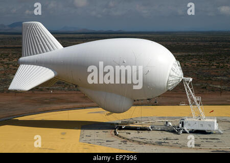 A U.S. Customs and Border Protection Office of Air and Marine Office Tethered Aerostat Radar System blimp used to monitor the border with Mexico moored to the tether in Ft. Huachuca, Arizona. Stock Photo