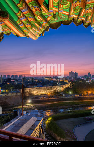 The sun sets behind Hwaseong Fortress in Suwon, South Korea. Stock Photo