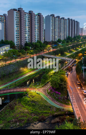 Urban scenic of a pathway and river cutting through the suburbs of Seoul, South Korea. Stock Photo