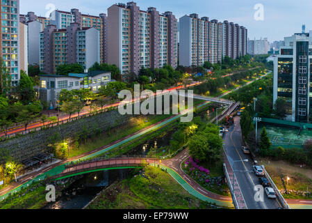 Urban scenic of a pathway and river cutting through the suburbs of Seoul, South Korea. Stock Photo