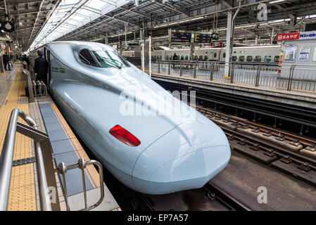 Passengers board the Shinkansen bullet train at Shin Osaka Station on December 29, 2014 in Osaka, Japan. Stock Photo