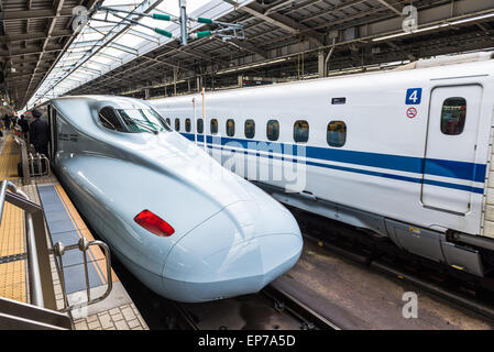 Passengers board the Shinkansen bullet train at Shin Osaka Station on December 29, 2014 in Osaka, Japan. Stock Photo