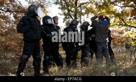 Bulgarian police officers guard a group of German activists at the Bulgarian-Turkey border, near the village of Golyam Dervent. A group of around one hundred German activists, arrived  in Bulgaria on Saturday for a commemorative ceremony on the occasion of the 25th anniversary of the fall of the Berlin Wall. They staged a demonstration at the border as a symbolic demolition of the fence at the Bulgarian-Turkish border.  Where: Golyam Dervent, Bulgaria When: 09 Nov 2014 Credit: Impact Press Group/WENN.com Stock Photo