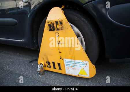 DVLA Wheel clamp on an illegally parked motor car Stock Photo