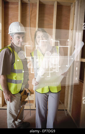 Architect and foreman checking the plans on white interface Stock Photo