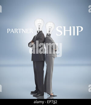 Business people with light bulbs instead of heads and partnership text Stock Photo