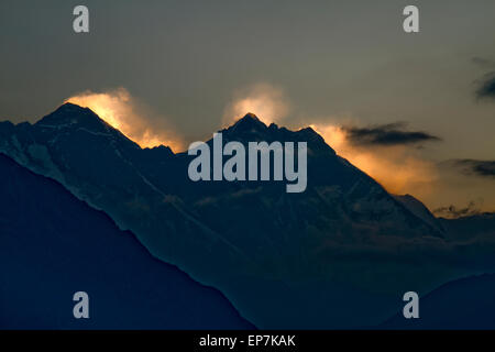 Sun setting behind Mount Everest seen from the Hotel Everest View, Solukhumbu, Nepal at 13000 feet high Stock Photo