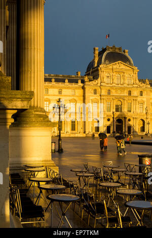 A sudden rainstorm over Musee du Louvre at sunset, Paris, France Stock Photo