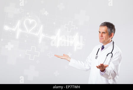 Doctor examinates heartbeat with abstract heart Stock Photo