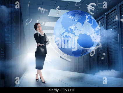 Businesswoman standing in data center with earth and currency graphics Stock Photo