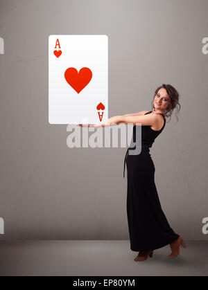 Beautifu woman holding a red heart ace Stock Photo