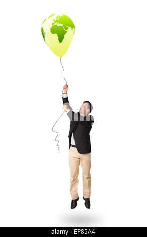 handsome man holding a green globe balloon Stock Photo