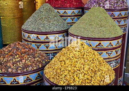 Ceramic pots of dried flowers, rose petals, buds and herbs in the souk. Morocco Stock Photo