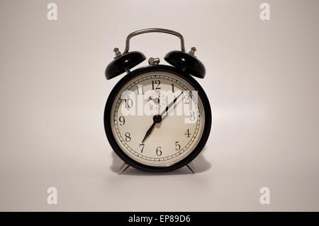 Retro alarm clock on white background Stock Photo