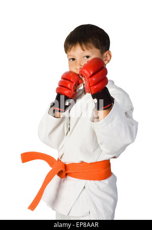 A young boy aikido fighter in white kimono showing martial arts isolated on white Stock Photo