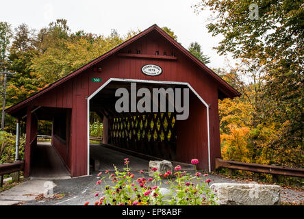 Autumn color at historic Creamery covered bridge in Battleboro, Vermont, fall New England autumn fall colour Vt, 1879 bridge, covered bridges zinnias Stock Photo