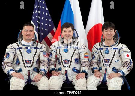 International Space Station Expedition 44 crew members (L to R): NASA astronaut Kjell Lindgren, Russian cosmonaut Oleg Kononenko and Japan Aerospace Exploration Agency astronaut Kimiya Yui official portrait wearing the the Sokol space suit February 24, 2015 in Houston, Texas. Stock Photo