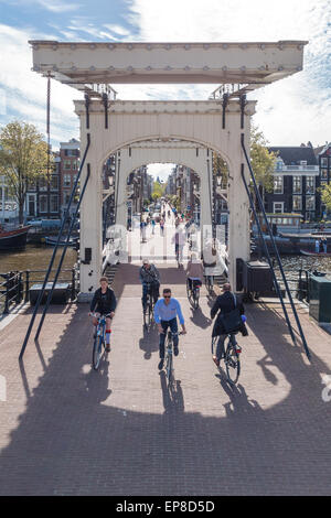 Amsterdam Magere Brug or Skinny Bridge a famous city landmark and an important link in a busy east west cross town cycle route Stock Photo