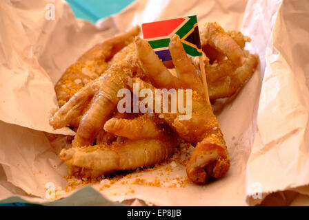 walkie talkies or chicken feet are a common south african street food they are chicken feet often served with pap and curried stew or deep fried Stock Photo