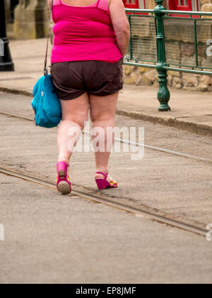 obese woman walking along street wearing tight clothes, in Matlock ...