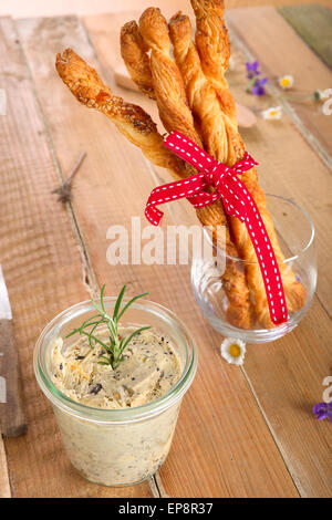 Olive butter spread and puff pastry sticks Stock Photo