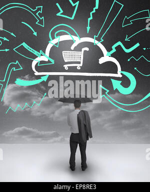 Businessman looking at a drawing of a cloud with shopping cart Stock Photo