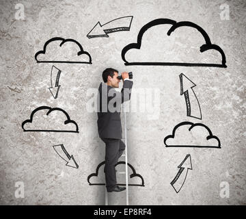 Businessman on a ladder with a process drawn behind Stock Photo
