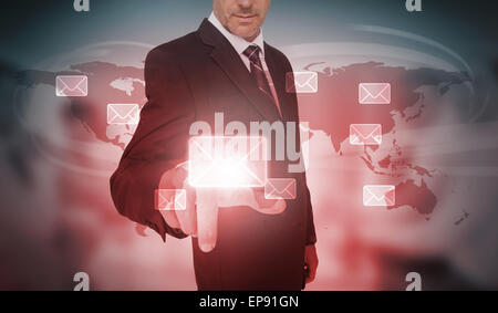 Businessman selecting futuristic email interface Stock Photo