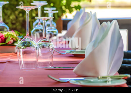 Solemnly laid table with wine glasses, outdoor Stock Photo