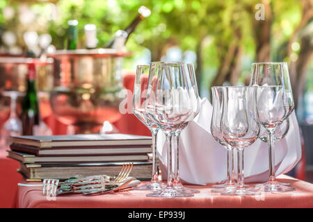 Solemnly laid table with wine glasses, outdoor Stock Photo