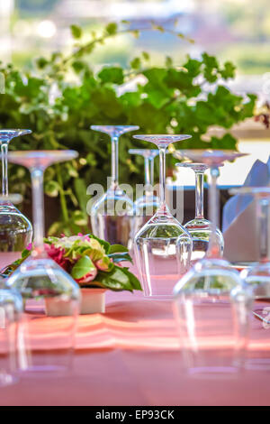 Solemnly laid table with wine glasses, outdoor Stock Photo