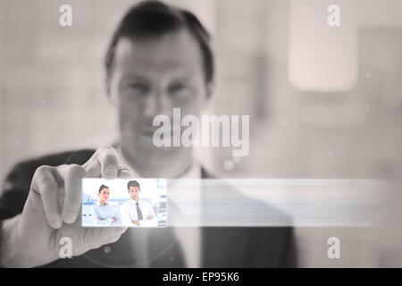 Classy businessman presenting digital interface Stock Photo