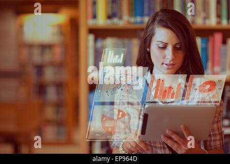 Pretty student working on her futuristic tablet pc Stock Photo