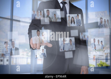 Stylish businessman presenting coworkers pictures Stock Photo