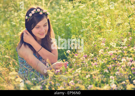 Beautiful teenage girl on the summer field Stock Photo