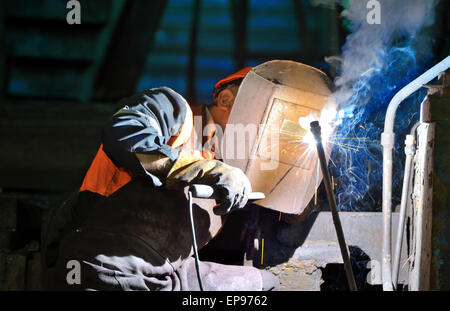 welder working  in manufacture production plant Stock Photo