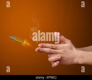 Gun shaped male hand with bullet Stock Photo