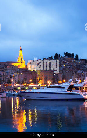 Menton harbor and the old town at dusk, France Stock Photo