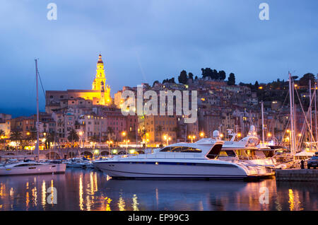 Menton harbor and the old town at dusk, France Stock Photo